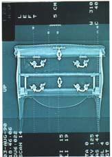 Scan of a Louis XV commode. The ‘internal aspects’ resulting from the tomographic cross-sections or conventional radiographs enable a precise examination of the assembly, thickness of the wood, etc, without taking it apart.